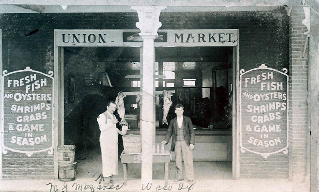 Mike (left) in front of Union Fish Market 